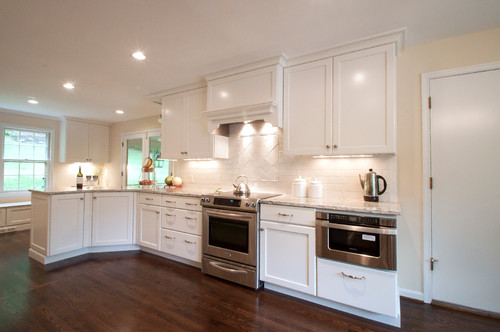 Cambria Praa Sands Countertop with Subway Tiles, Dove White Finish Maple Cabinets and Dark Hardwood Flooring